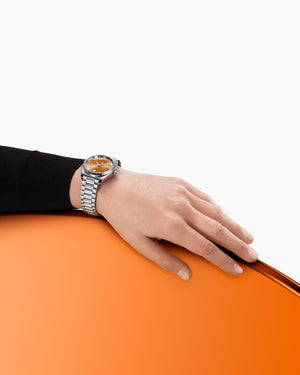 Omega Seamaster Aqua Terra Shades 220.10.38.20.12.001 automatic watch, 38mm stainless steel case, orange dial, steel bracelet – lifestyle wrist view
