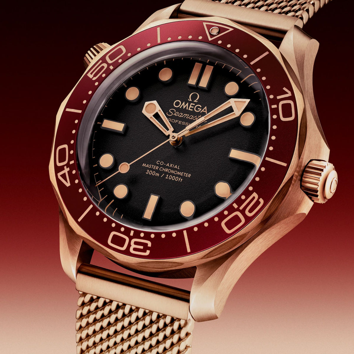 Omega Seamaster Diver 300M Bronze Gold men's automatic watch, 42mm bronze gold case, black dial, burgundy bezel, mesh bracelet – dial close-up
