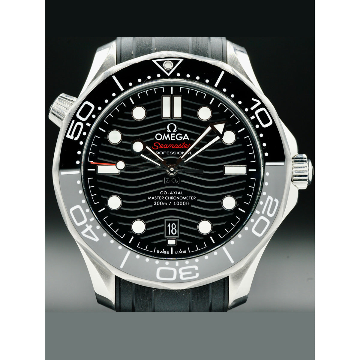 Omega Seamaster Diver 300M men's automatic watch, 42mm stainless steel case, black dial, black rubber strap – front view on dark background