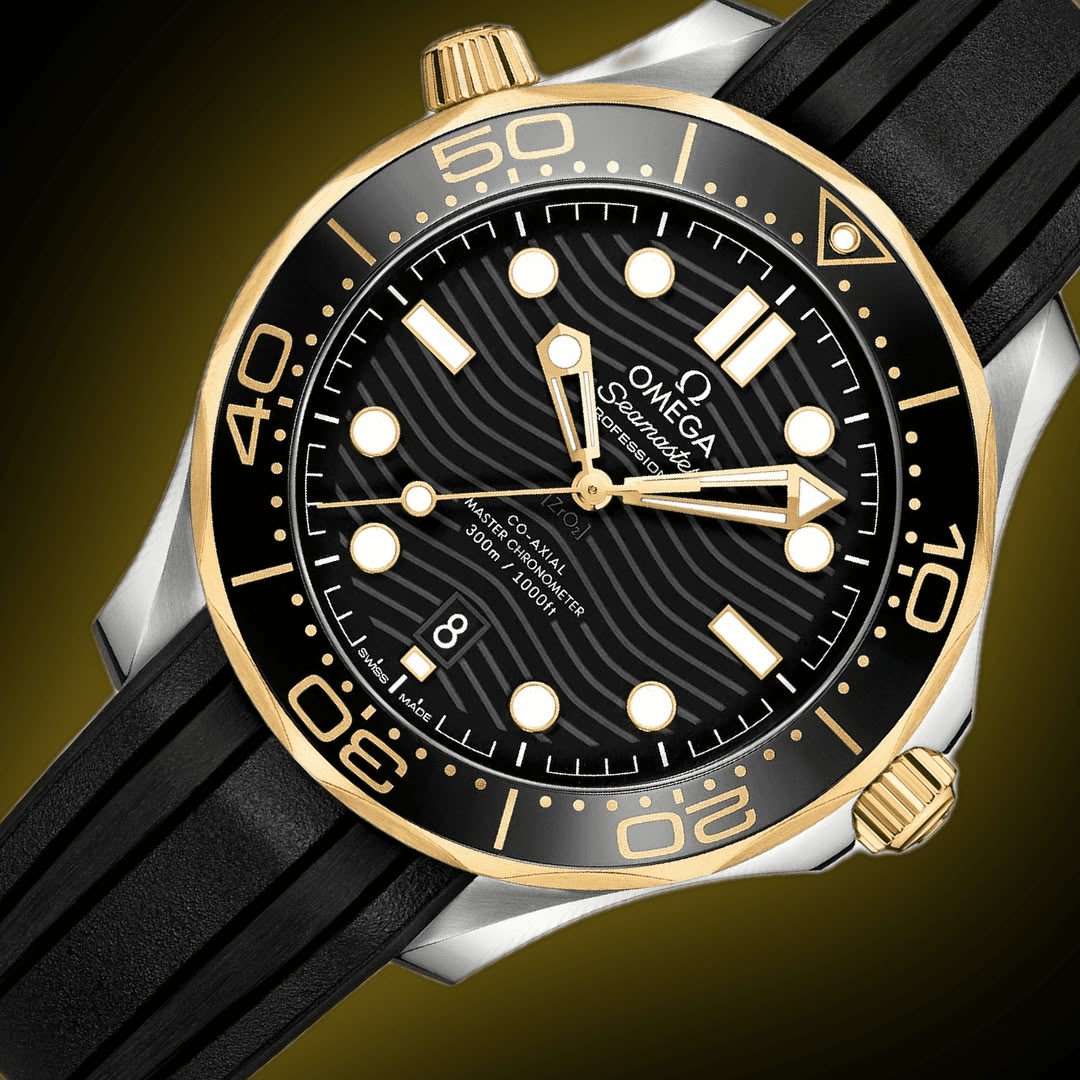 Omega Seamaster Diver 300M men's automatic watch, 42mm steel and yellow gold case, black dial, black rubber strap – dial angle on dark background
