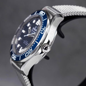 Omega Seamaster Diver 300M men's automatic watch, 42mm stainless steel case, blue ceramic bezel, mesh bracelet – left angle close-up