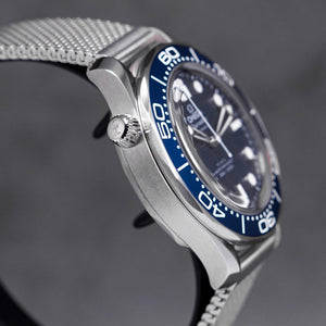Omega Seamaster Diver 300M men's automatic watch, 42mm stainless steel case, blue ceramic bezel, mesh bracelet – right angle close-up