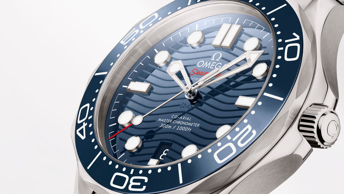Omega Seamaster Diver 300M men's automatic watch, 42mm stainless steel case, blue dial, steel bracelet – side angle view