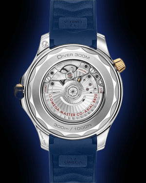 Omega Seamaster Diver 300M men's automatic watch, 42mm steel and yellow gold case, blue dial, blue rubber strap – caseback on dark background