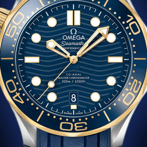 Omega Seamaster Diver 300M men's automatic watch, 42mm steel and yellow gold case, blue dial, blue rubber strap – dial close-up
