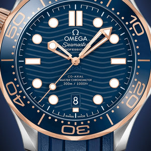 Omega Seamaster Diver 300M men's automatic watch, 42mm steel and rose gold case, blue dial, blue rubber strap – dial close-up