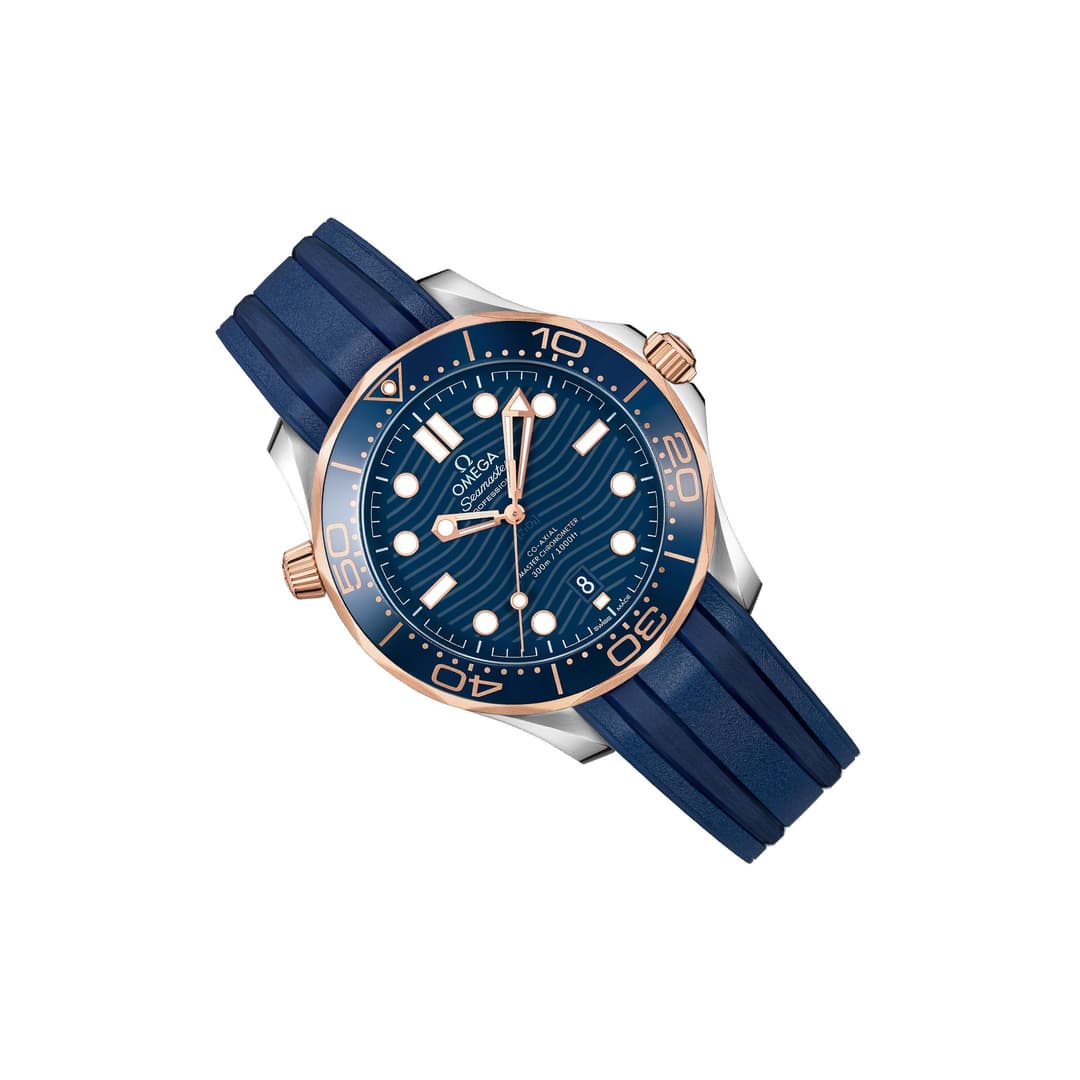 Omega Seamaster Diver 300M men's automatic watch, 42mm steel and rose gold case, blue dial, blue rubber strap – left angle view
