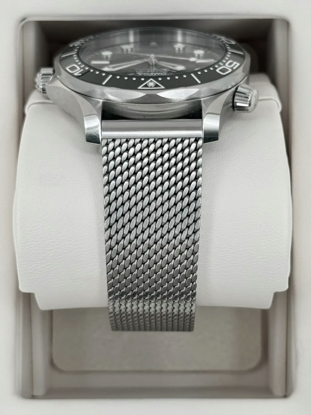 Omega Seamaster Diver 300M men's automatic watch, 42mm stainless steel case, green dial, mesh bracelet – side view in box