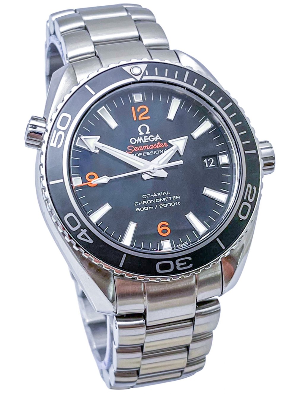 Omega Seamaster Planet Ocean 600M men's quartz watch, 42mm stainless steel case, black dial with orange numerals, steel bracelet – full front view