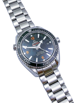Omega Seamaster Planet Ocean 600M men's quartz watch, 42mm stainless steel case, black dial with orange numerals, steel bracelet – right angle view