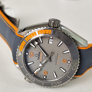Omega Seamaster Planet Ocean 600M Titanium men's automatic watch, 43.5mm titanium case, grey dial, orange bezel, rubber strap – angle view