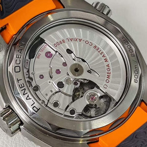 Omega Seamaster Planet Ocean 600M Titanium men's automatic watch, 43.5mm titanium case, grey dial, orange bezel, rubber strap – caseback movement view