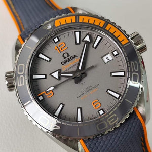 Omega Seamaster Planet Ocean 600M Titanium men's automatic watch, 43.5mm titanium case, grey dial, orange bezel, rubber strap – dial angle close-up
