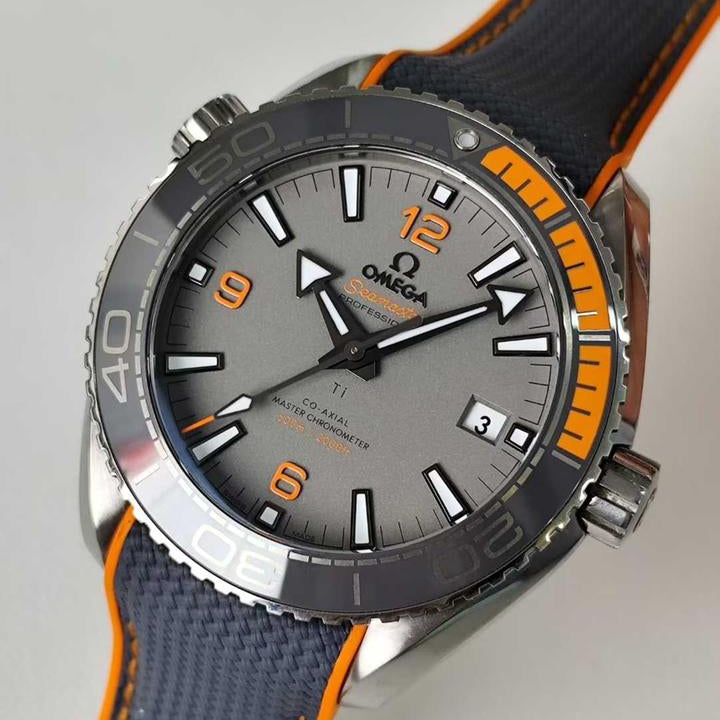 Omega Seamaster Planet Ocean 600M Titanium men's automatic watch, 43.5mm titanium case, grey dial, orange bezel, rubber strap – side angle view