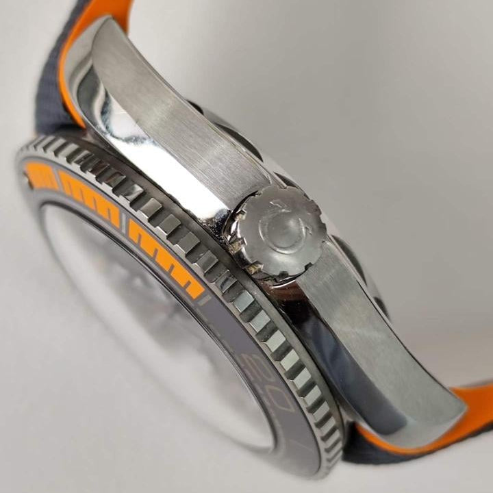 Omega Seamaster Planet Ocean 600M Titanium men's automatic watch, 43.5mm titanium case, grey dial, orange bezel, rubber strap – side profile view