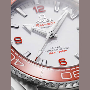 Omega Seamaster Planet Ocean men's automatic watch, 43.5mm stainless steel case, white dial, orange bezel, steel bracelet – dial close-up
