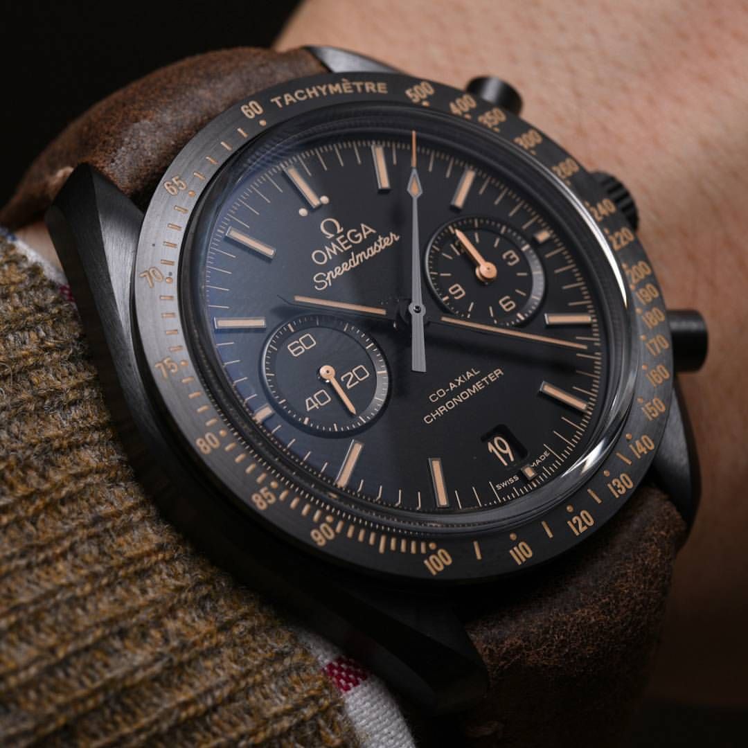 Omega Speedmaster Dark Side of the Moon men's chronograph watch, 43mm black case, black dial, tan leather strap – dial close-up