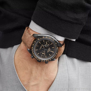 Omega Speedmaster Dark Side of the Moon men's chronograph watch, 43mm black case, black dial, tan leather strap – on wrist view