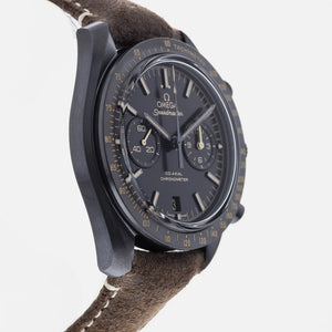 Omega Speedmaster Dark Side of the Moon men's chronograph watch, 43mm black case, black dial, tan leather strap – side angle view