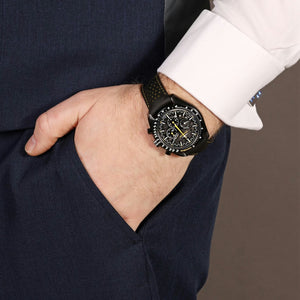 Omega Speedmaster Dark Side of the Moon Style men's chronograph watch, 45mm black case, black dial with yellow accents, black leather strap – lifestyle wrist view
