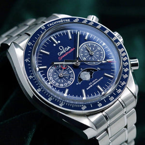 Omega Speedmaster Moonphase men's chronograph watch, 44mm stainless steel case, blue moonphase dial, steel bracelet – dial close-up on dark background