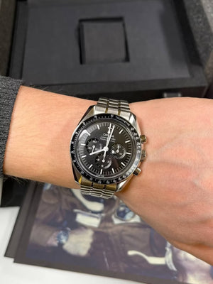 Omega Speedmaster Professional Moonwatch men's chronograph watch, 42mm stainless steel case, black dial, steel bracelet – on wrist view