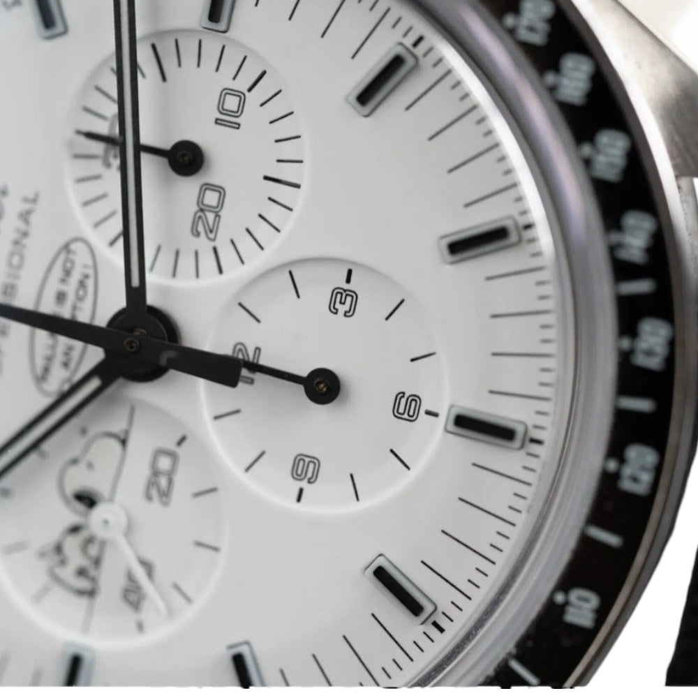 Omega Speedmaster Snoopy Award men's chronograph watch, 42mm stainless steel case, white dial with black subdials, black fabric strap – dial close-up