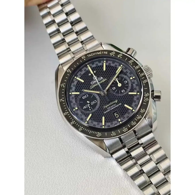 Omega Speedmaster Super Racing men's chronograph watch, 44.25mm stainless steel case, black dial, steel bracelet – hand-held view