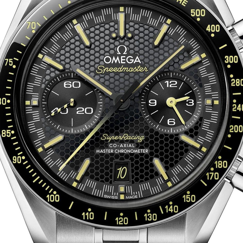 Omega Speedmaster Super Racing men's chronograph watch, 44.25mm stainless steel case, black dial with yellow accents – dial detail close-up