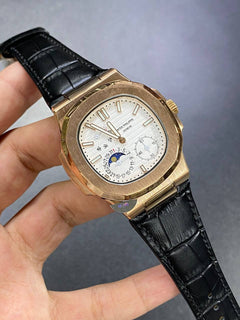 Patek Philippe Nautilus Moon Phase 40mm Men's Automatic Watch – White Dial, Rose Gold Case & Black Leather Strap | ساعة باتيك فيليب نوتيلس رجالي مينا أبيض