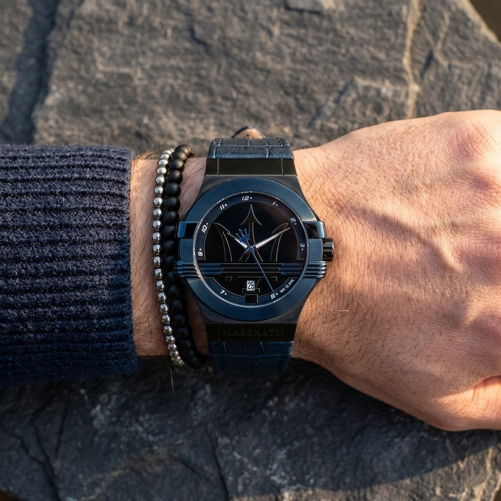 Close up of Maserati Potenza R8851108007 men's quartz battery watch on wrist showing black dial and blue-tone case