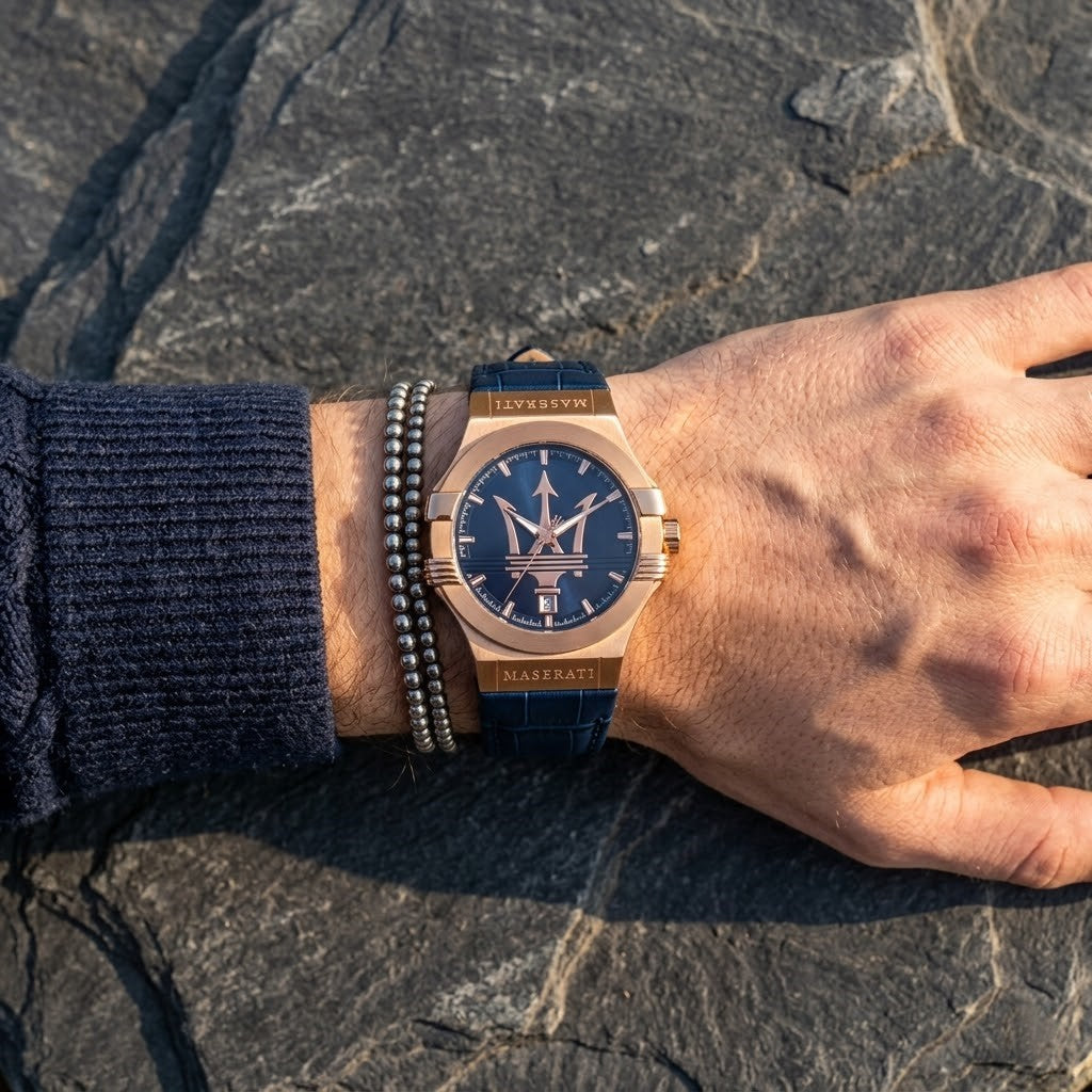 Close up of Maserati Potenza R8851108027 men's quartz battery watch on wrist showing blue textured dial and rose gold-tone case