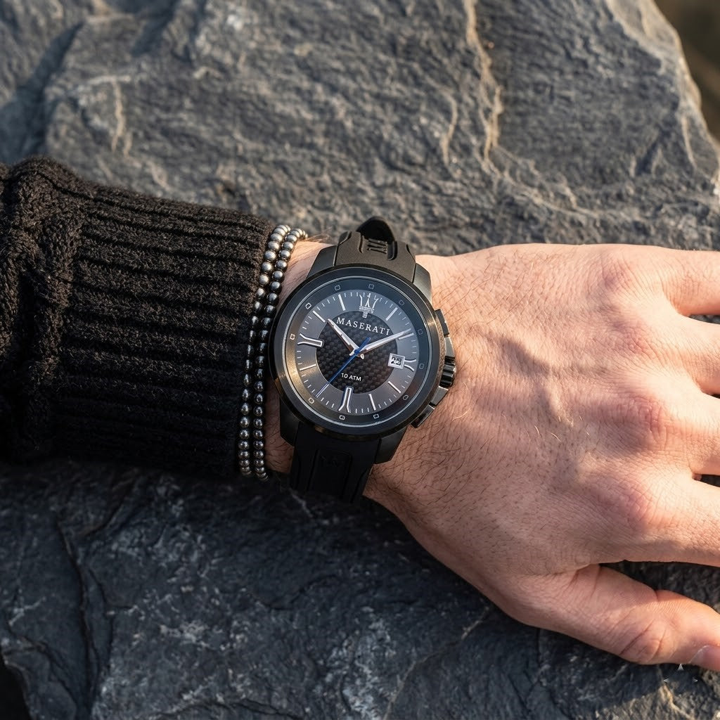 Close up of Maserati Sfida R8851123004 men's quartz battery watch on wrist showing black carbon fiber racing dial and blue hand