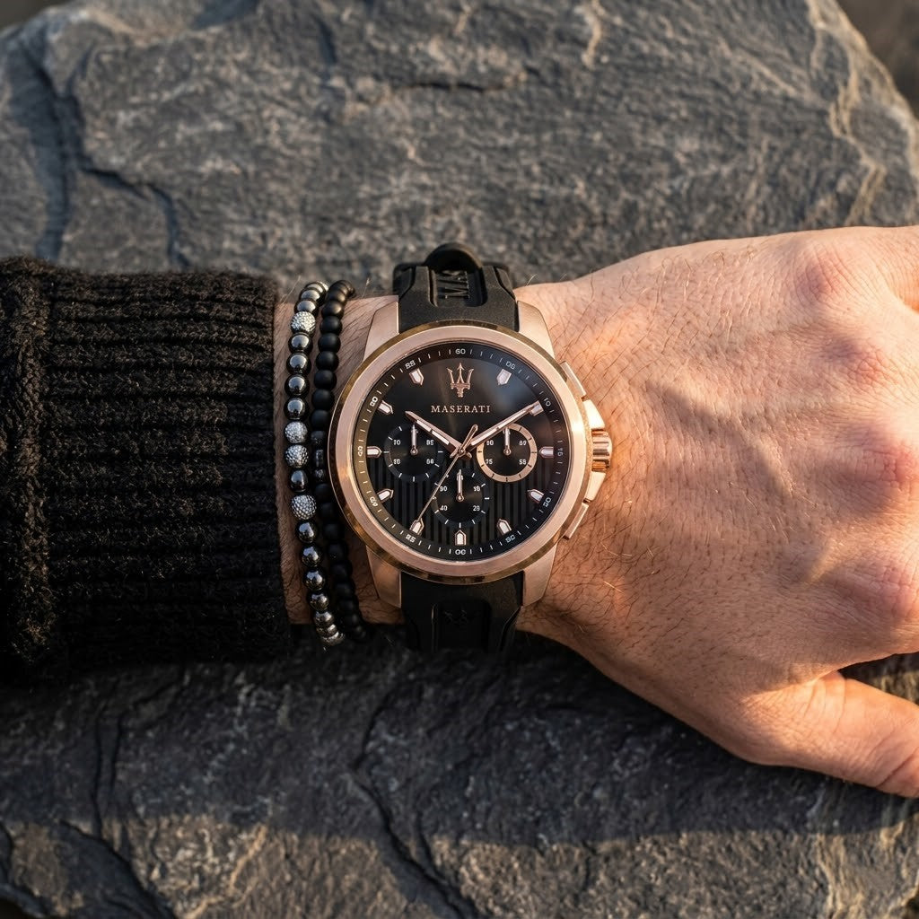 Close up of Maserati Sfida R8851123008 men's quartz battery watch on wrist showing black racing dial and rose gold-tone case