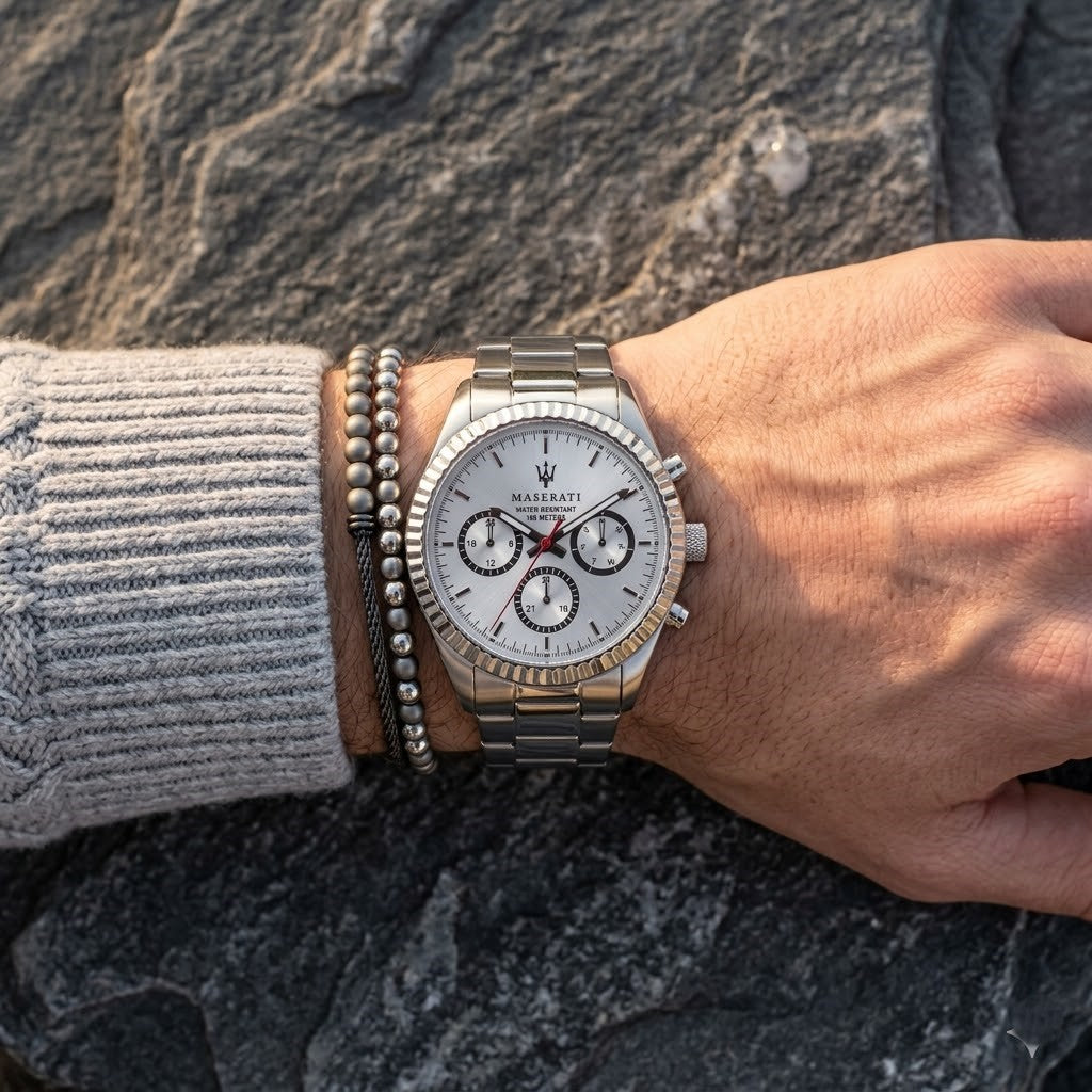Close up of Maserati Competizione R8853100018 men's quartz battery watch on wrist showing silver multi-function dial and silver metal bracelet