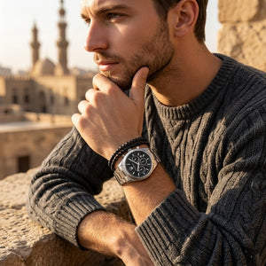 Elegant man wearing Maserati Competizione R8853100023 men's quartz battery watch with silver-tone case and luxury black dial