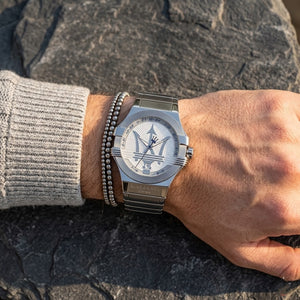 Close up of Maserati Potenza Corse R8853108002 men's quartz battery watch on wrist showing silver dial and silver-tone case