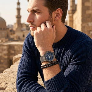 Elegant man wearing Maserati Potenza R8853108005 men's quartz battery watch with grey matte case and modern mesh strap
