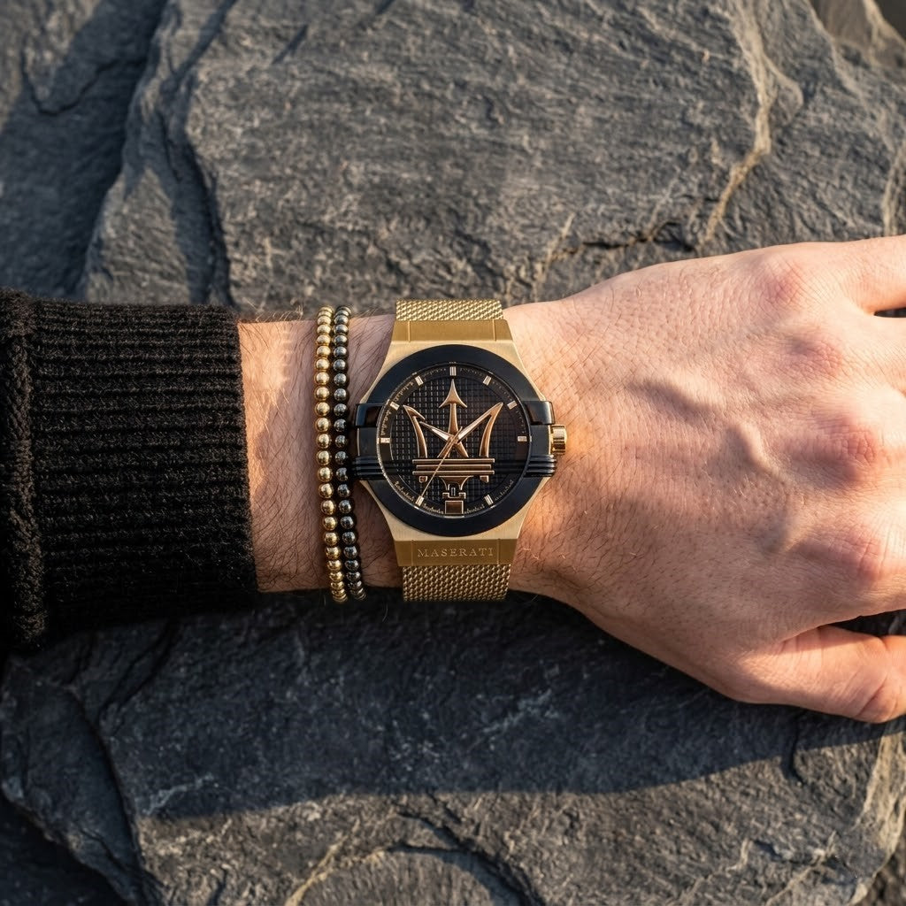 Close up of Maserati Potenza R8853108006 men's quartz battery watch on wrist showing black textured dial and gold mesh metal strap