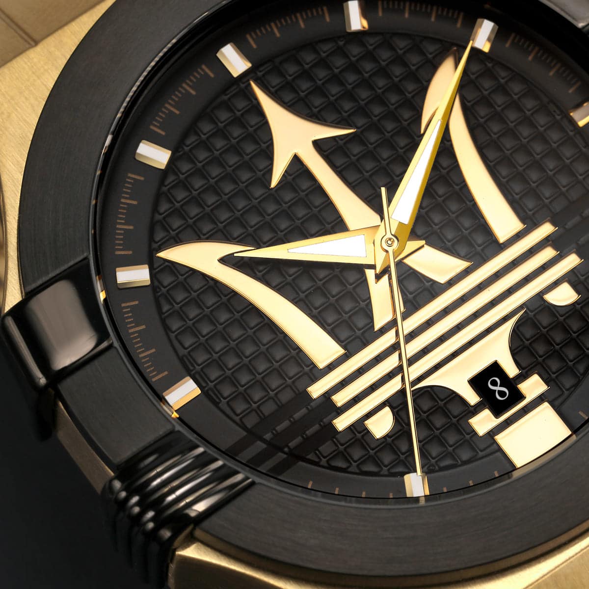 Black and gold watch with a unique design on the dial