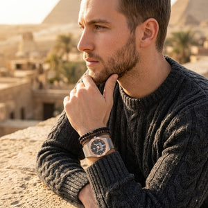 Elegant man wearing Maserati Potenza R8853108007 men's quartz battery watch with silver and rose gold case and luxury mesh strap