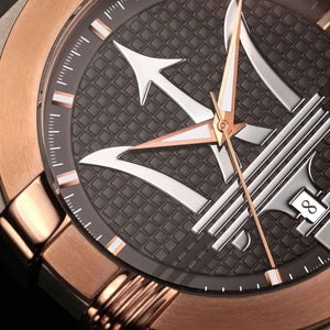 Close-up of a luxury watch with rose gold and silver accents on a dark textured background