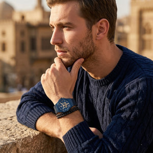 Elegant man wearing Maserati Potenza R8853108008 men's quartz battery watch with blue case and luxury gold accented dial