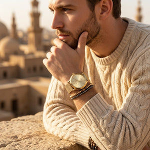 Elegant man wearing Maserati Epoca R8853118003 men's quartz battery watch with gold case and luxury gold dial