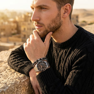 Elegant man wearing Maserati Sfida R8853140002 men's quartz battery watch with silver-tone case and luxury black dial