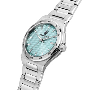 A Maserati stainless steel watch with a textured light blue dial and matching blue accents, set against a plain white background.