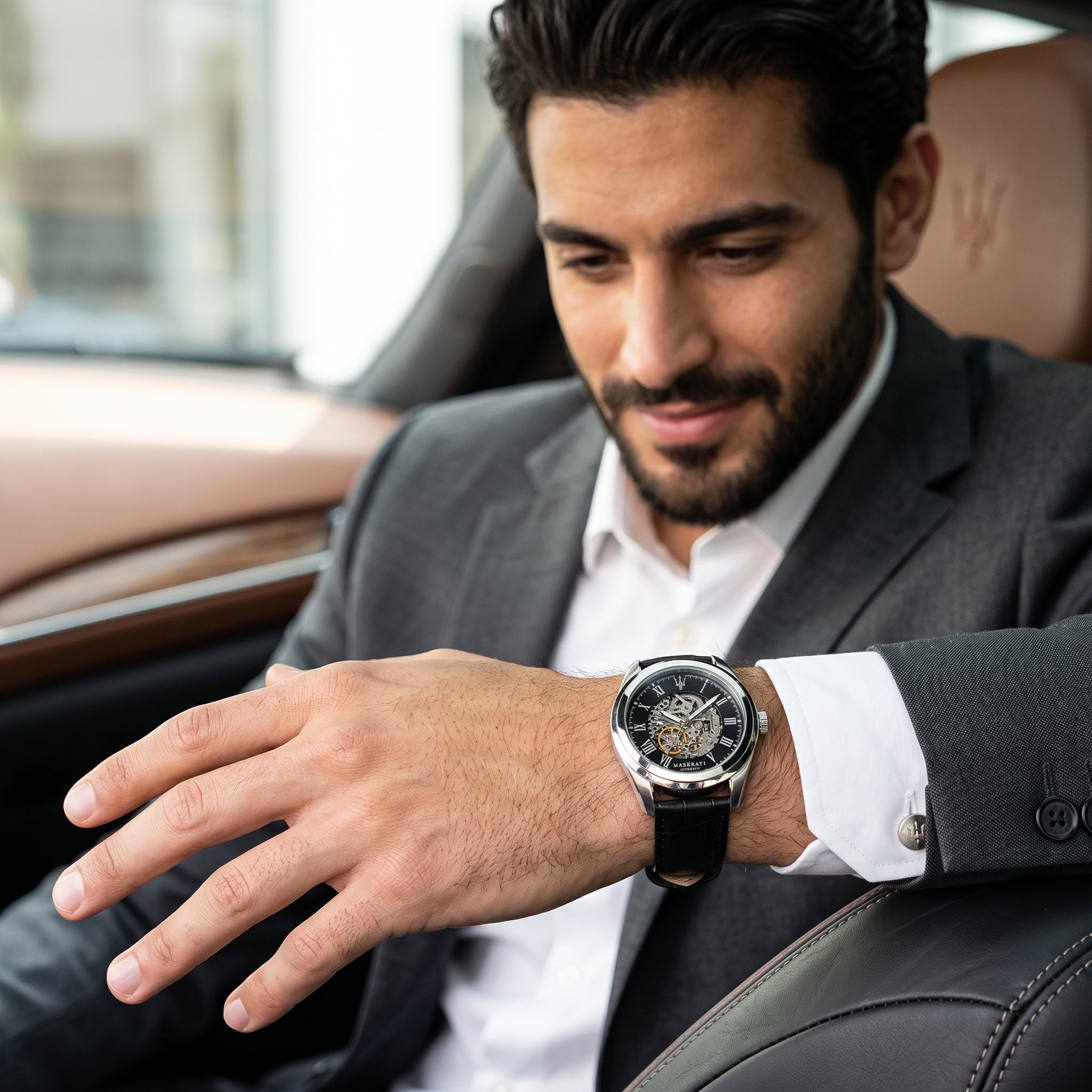 Lifestyle luxury shot featuring the Maserati Traguardo R8871612001 automatic skeleton watch.