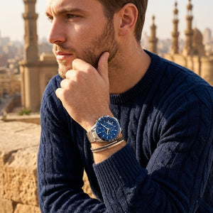 Elegant man wearing Maserati Traguardo R8871612039 men's quartz battery watch with silver-tone case and racing style blue dial