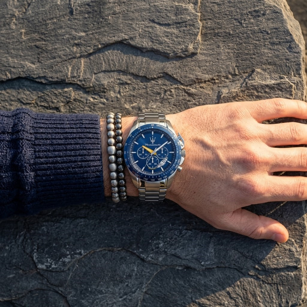 Close up of Maserati Traguardo R8871612039 men's quartz battery watch on wrist showing blue chronograph dial and silver metal bracelet