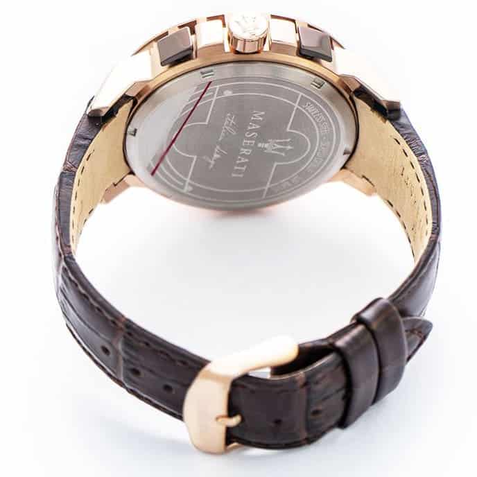 Caseback of Maserati Ingegno R8871619001 men's quartz battery watch showing technical specs 100m water resistance and leather strap